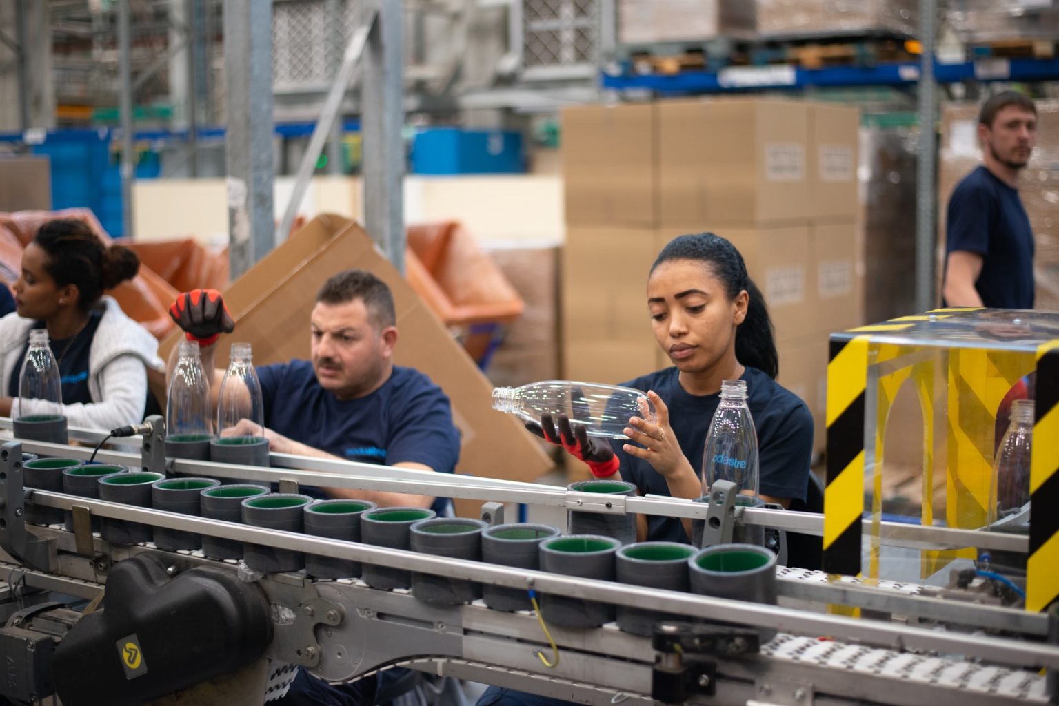 a group of people at a factory