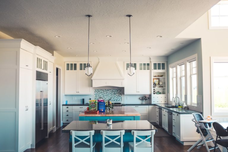 a kitchen with a table and chairs