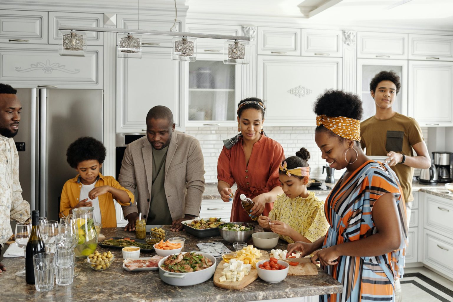 a group of people in a kitchen