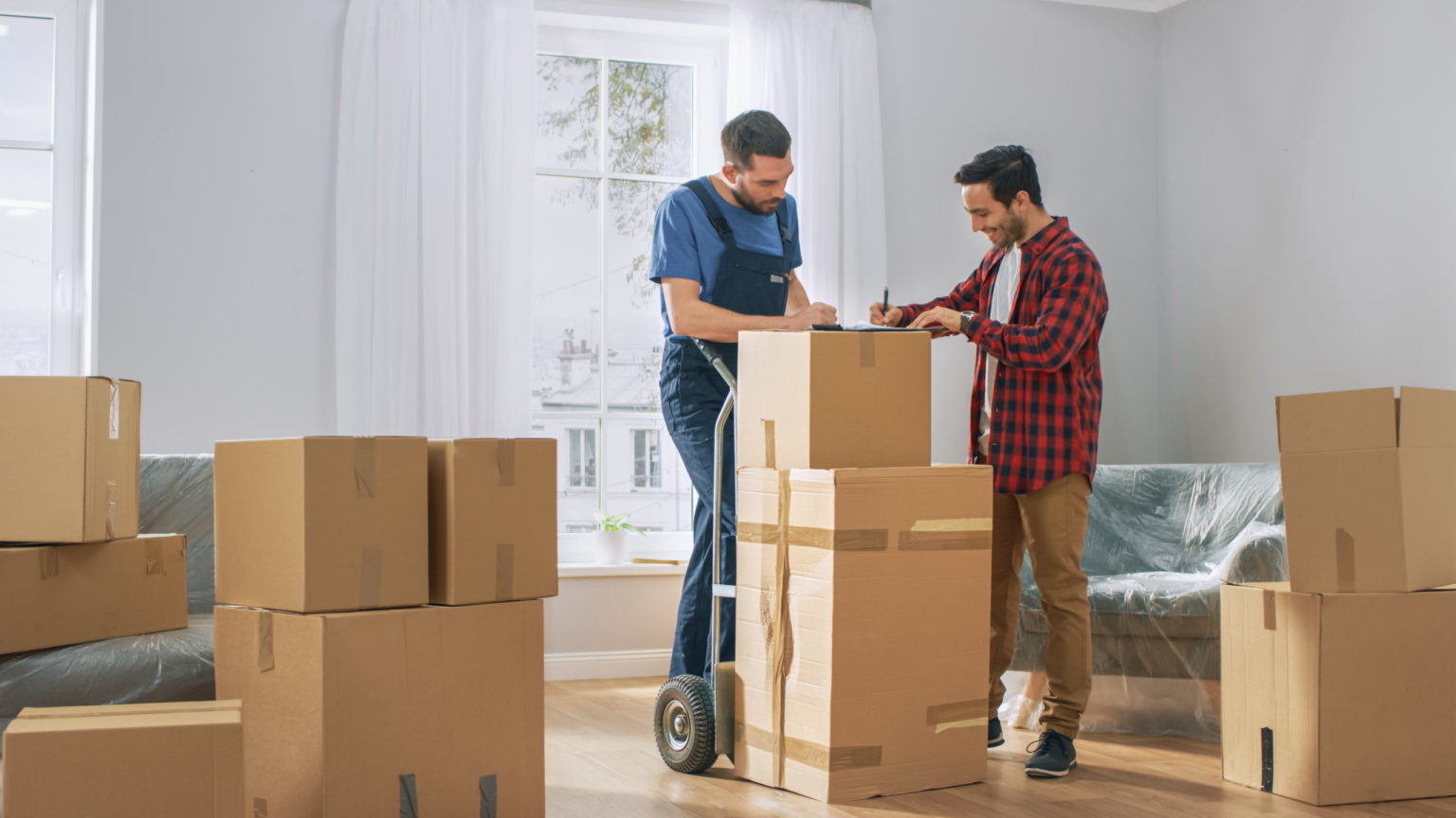 men in a room with boxes