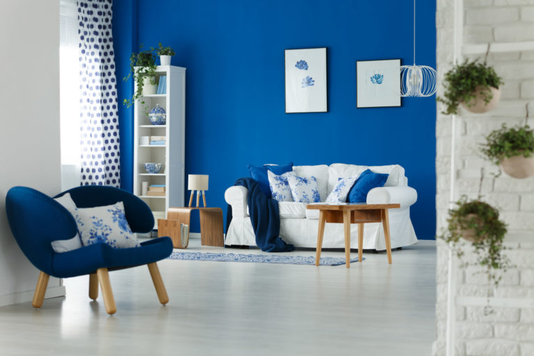 a living room with a blue wall