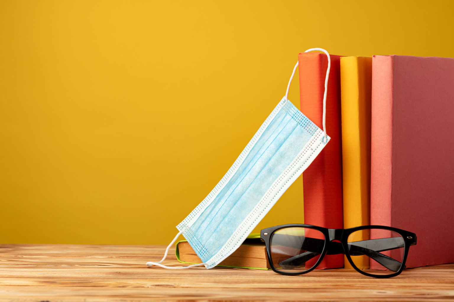 a pile of books and glasses