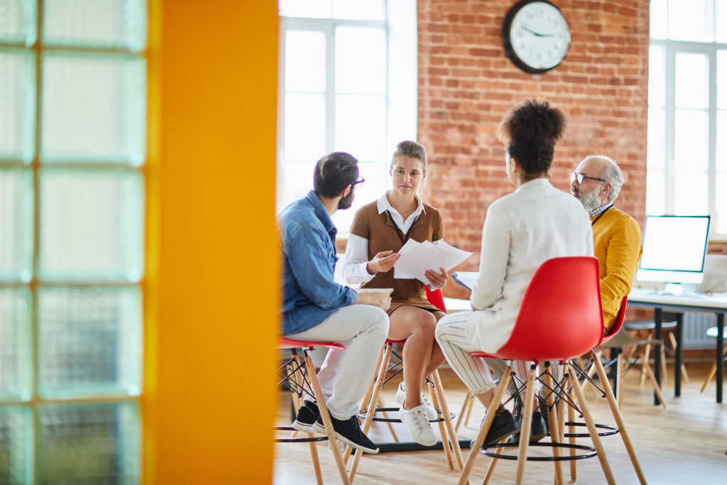 a group of people sitting in chairs