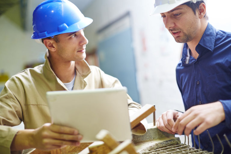 construction workers going over plans