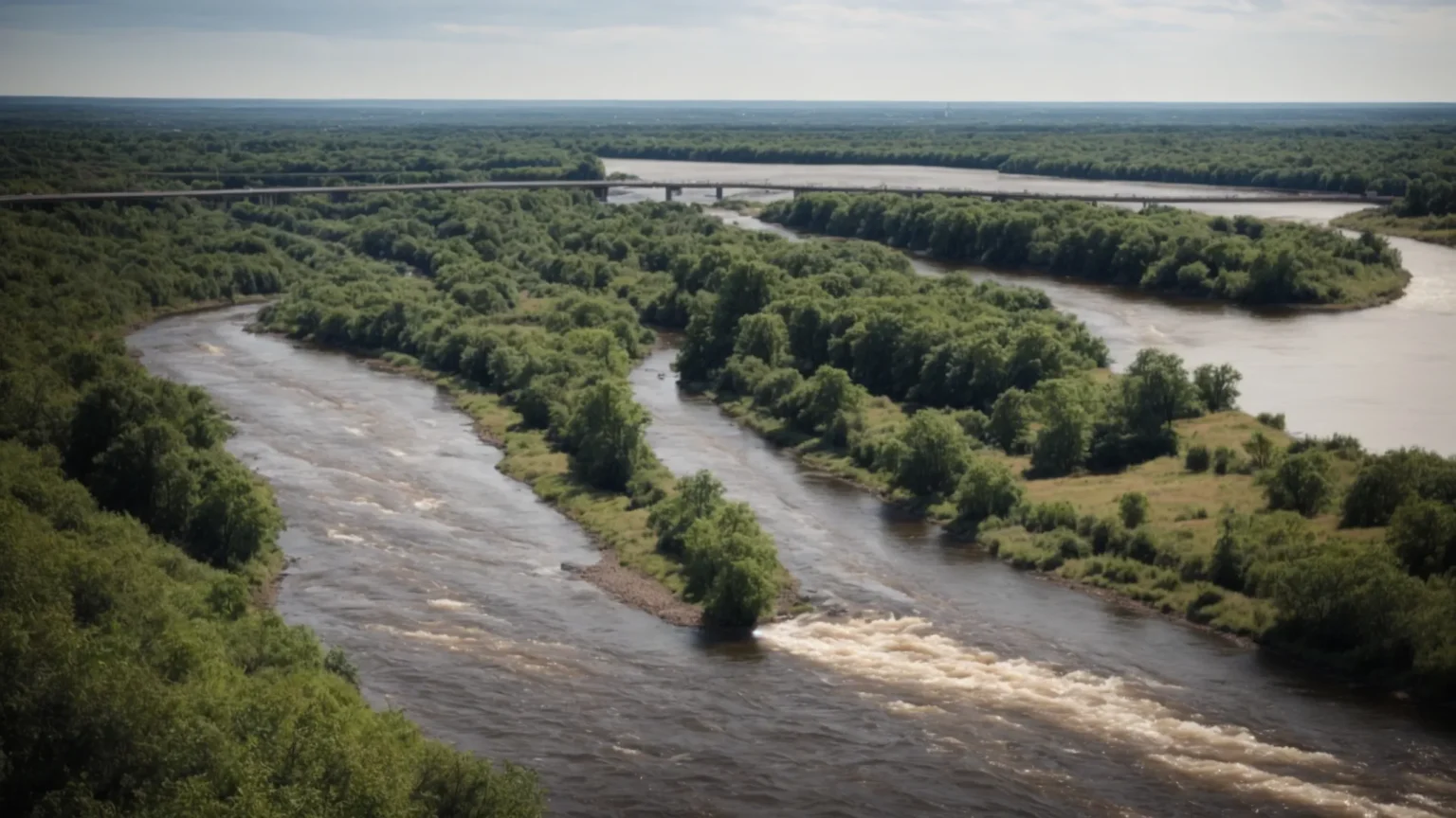 a picture of the scenic raritan river flowing through new brunswick with a view of the cityscape in the background.